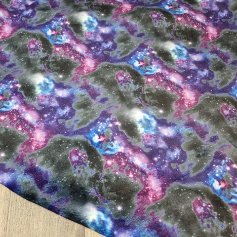 1m. BOLT END. Purple galaxy squish fabric. PATCHY COLOUR
