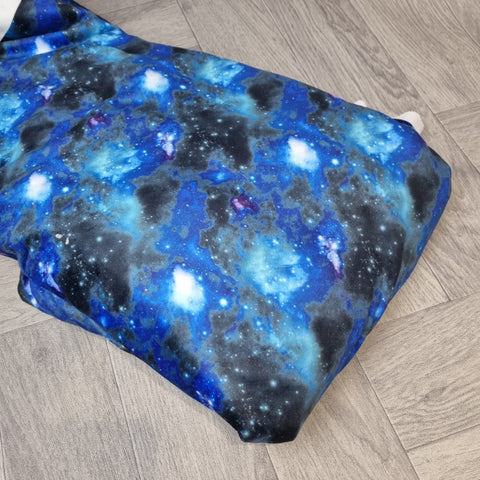 1m. BOLT END. Blue galaxy squish fabric. PATCHY COLOUR