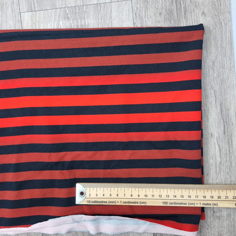 52cm BOLT END. Red ombre stripes 220gsm jersey fabrics. Some FLAWS of black marks