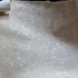 37x68cm BOLT END. Peachy cream. Black mark. Lace Effect Floral Faux leather / vinyl fabric.