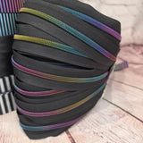 Dark semi matte rainbow zipper tape #5, sold by Meter