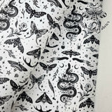 Serpent and Moths White Faux leather vinyl fabric. 39x66cm roll