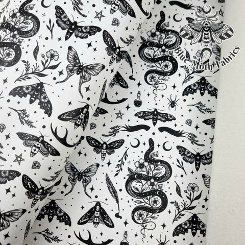 Serpent and Moths White Faux leather vinyl fabric. 39x66cm roll