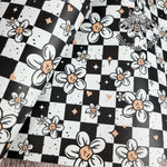 Checkerboard Daisies Faux leather / vinyl fabric. 39x66cm roll