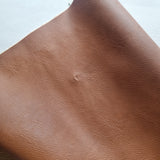 41x 71cm BOLT END. 11 cinnamon brown. SMALL DENT. Solid Marble Grain Faux leather / vinyl fabric.
