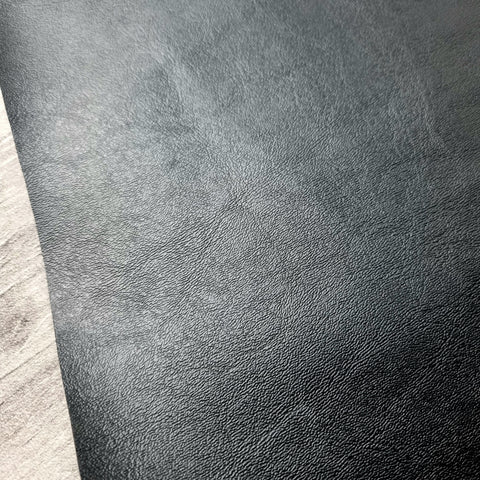 Black Solid Faux leather / vinyl fabric. 40x150cm roll. woven backing