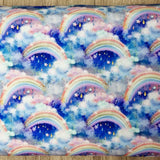 Rainbow clouds blue heavyweight jersey fabric